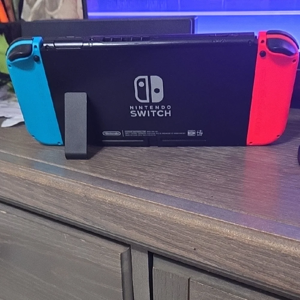 Nintendo Console with Vibrant Red and Blue Controllers